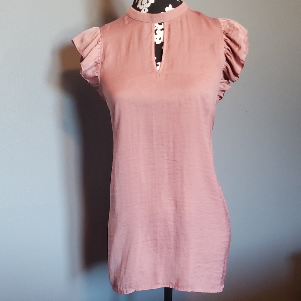 Feminine pink keyhole blouse.